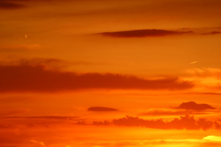 Vibrant sunset over the horizon, painting the sky with brilliant colors.の写真素材