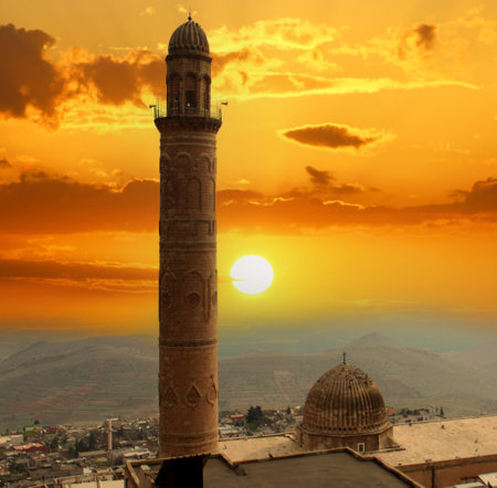 Sunset over a mosque minaret in a Middle Eastern city. Mardin Mosque and Minaret.の写真素材