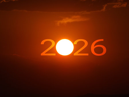 Happy New Year 2026 Idea. Transition from 2025 to new year 2026 concept with text on sun rising sky. Creative Concept.の写真素材