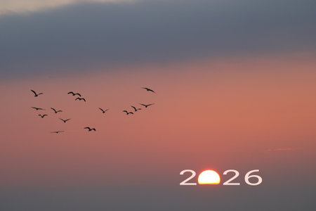 Happy New Year 2026 Idea. Transition from 2025 to new year 2026 concept with text on sun rising sky. Creative Concept.の写真素材