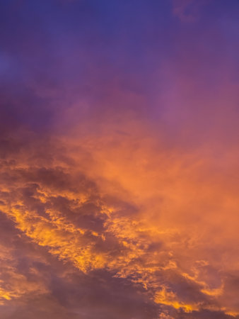 Vibrant Sunset Sky A Canvas of Fiery Hues and Ethereal Clouds.