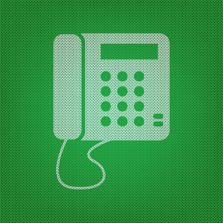 Communication or phone sign. white icon on the green knitwear or woolen cloth texture.のイラスト素材