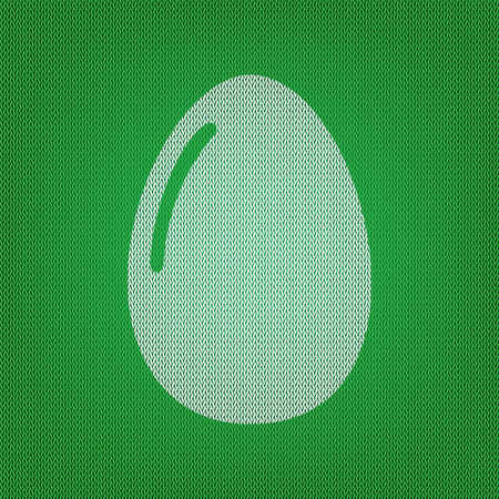 Chiken egg sign. white icon on the green knitwear or woolen cloth texture.のイラスト素材