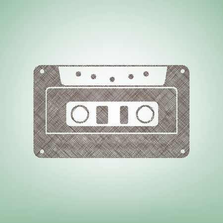 Cassette icon, audio tape sign. Vector. Brown flax icon on green background with light spot at the center.のイラスト素材