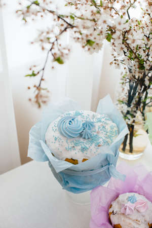 Beautiful Easter cakes on a decorated light table. A light holiday of Easter.