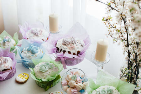 Beautiful Easter cakes on a decorated light table. A light holiday of Easter.