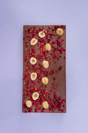 Natural handmade chocolate close-up on a bright background.