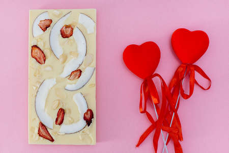 Natural handmade chocolate close-up on a bright background.