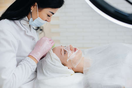 Young girls do mechanical face cleaning in a modern cosmetology clinic. Cosmetology.の写真素材