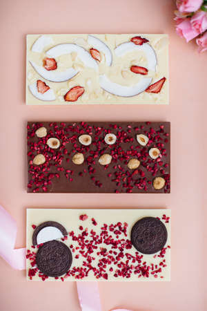 Natural handmade chocolate close-up on a bright background.