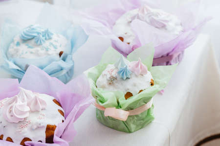 Beautiful Easter cakes on a decorated light table. A light holiday of Easter.