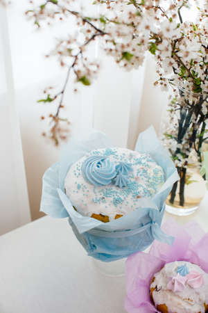 Beautiful Easter cakes on a decorated light table. A light holiday of Easter.