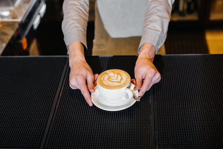 Barista serving delicious natural coffee close-up. Delicious coffee close-up.の写真素材