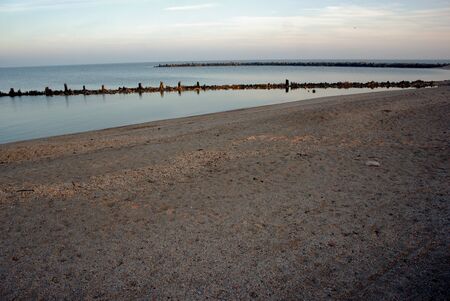 deserted beach shore in the resort town of Yeisk in the autumn eveningの写真素材