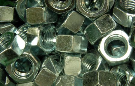 A pile of zinc plated hex nuts