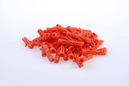 A lot of orange dowels on white groundの写真素材