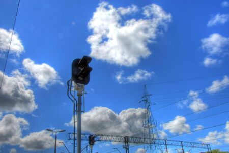 Electrical overhead train wires details closeup on couldy skyの写真素材