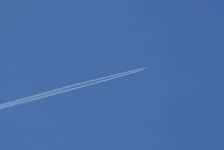 Jet plane in the sky with traces
