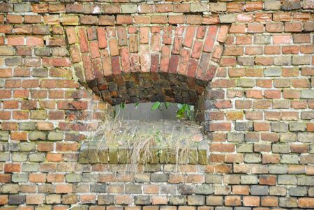 Small window on the walls of Napoleon fortress in Gdansk, Polandの写真素材