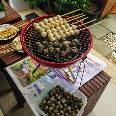 pork meatball toast with skewer stick on the grille.の写真素材