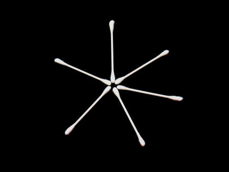 Cotton buds isolated on black backgroundの写真素材