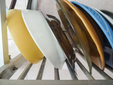 Metal dish rack with dish , bowl ,  cup in kitchenの写真素材