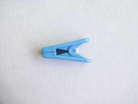 blue clothes peg isolated on white backgroundの写真素材