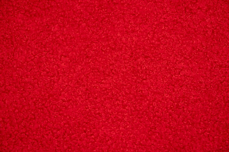 Macro shot of a vivid red fabric texture, ideal for a colorful and vibrant background..の写真素材