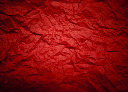 Red background with crumpled pattern and lens vignetting   horizontal  の写真素材