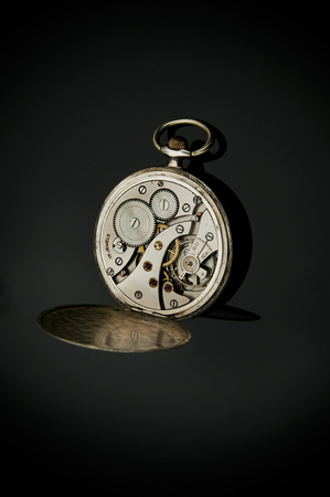 Antique pocket watches mechanic isolated on black の写真素材