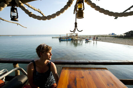Young pretty girl sunbathing on a restaurant boat in Montenegro の写真素材