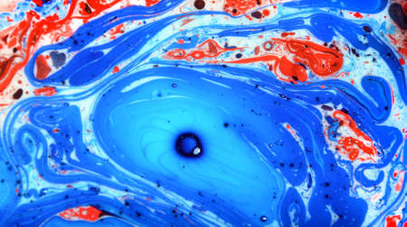 Photographs of Splash paint.Closeup abstract color mixing of water, acrylic,oil and milk for use as background image. Acrylic texture with marble or ocean pattern, multi color background photoの写真素材