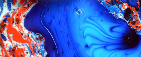 Photographs of Splash paint.Closeup abstract color mixing of water, acrylic,oil and milk for use as background image. Acrylic texture with marble or ocean pattern, multi color background photoの写真素材