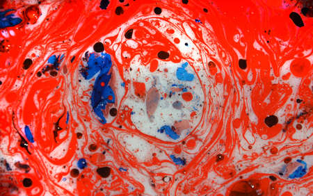Photographs of Splash paint.Closeup abstract color mixing of water, acrylic,oil and milk for use as background image. Acrylic texture with marble or ocean pattern, multi color background photoの写真素材