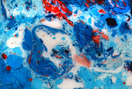 Photographs of Splash paint.Closeup abstract color mixing of water, acrylic,oil and milk for use as background image. Acrylic texture with marble or ocean pattern, multi color background photoの写真素材