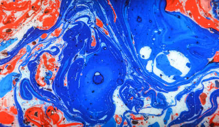 Photographs of Splash paint.Closeup abstract color mixing of water, acrylic,oil and milk for use as background image. Acrylic texture with marble or ocean pattern, multi color background photoの写真素材