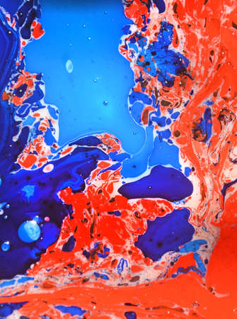 Photographs of Splash paint.Closeup abstract color mixing of water, acrylic,oil and milk for use as...