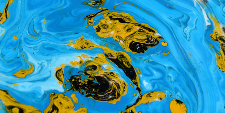 abstract background of blue and yellow ink in water close-upの写真素材