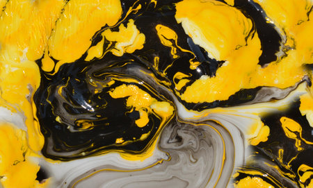 Yellow and black abstract background. Marbling texture. Agate ripple pattern. Gold powder.の写真素材