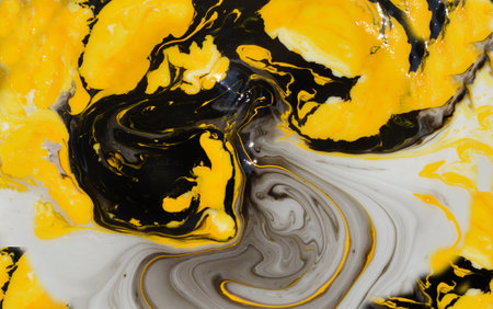 Yellow and black marbling pattern. Golden marble liquid texture. Fluid art.の写真素材
