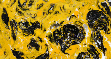Yellow and black marbling pattern. Golden marble liquid texture. Fluid art.の写真素材