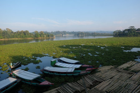Boats moored on the bank of the river in the morningの写真素材