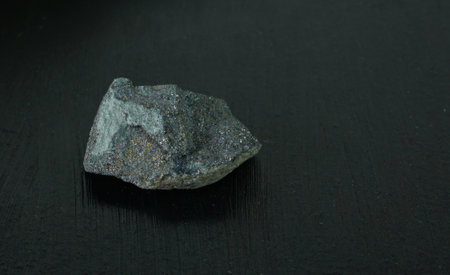 Unpolished Chalcopyrite natural mineral stone from Morocco or Republic of South Africa RSA on black...