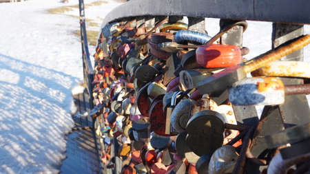 Love Padlocks Lockers at the bridge in Russia. People have place padlocks on the fence symbolizing...