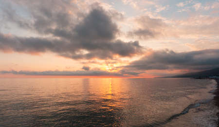 Amazing beach sunset over Black Sea. Lazarevskoye, Sochi, Russiaの写真素材