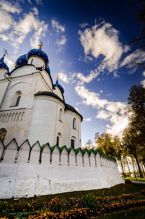 The white stone Cathedral with beautiful domes in Suzdal at sunsetの写真素材
