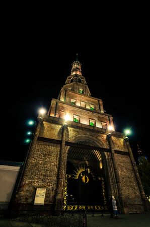From below shot of old brick Syuyumbike tower illuminated with lanterns in city of Kazan.の写真素材