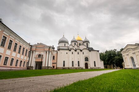 Exterior view of ancient white cathedral in green park in city of Velikiy Novgorod.の写真素材