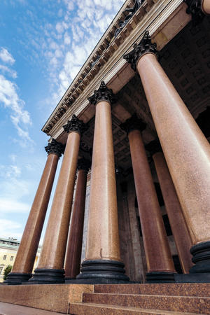 From below shot of impressive tall columns of entrance to Saint Isaac Cathedral in Saint Petersburg.の写真素材