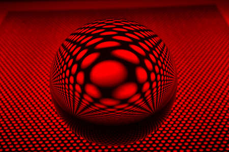 Glass ball with perforated plateの写真素材